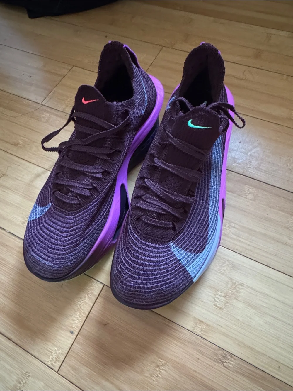 Nike Women’s Flyknit Trainers — Plum with Pink Accents
